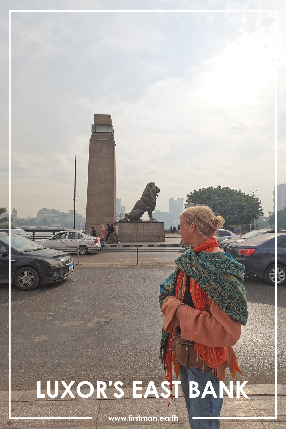 women standing infront of a lion statue in luxor, egypt