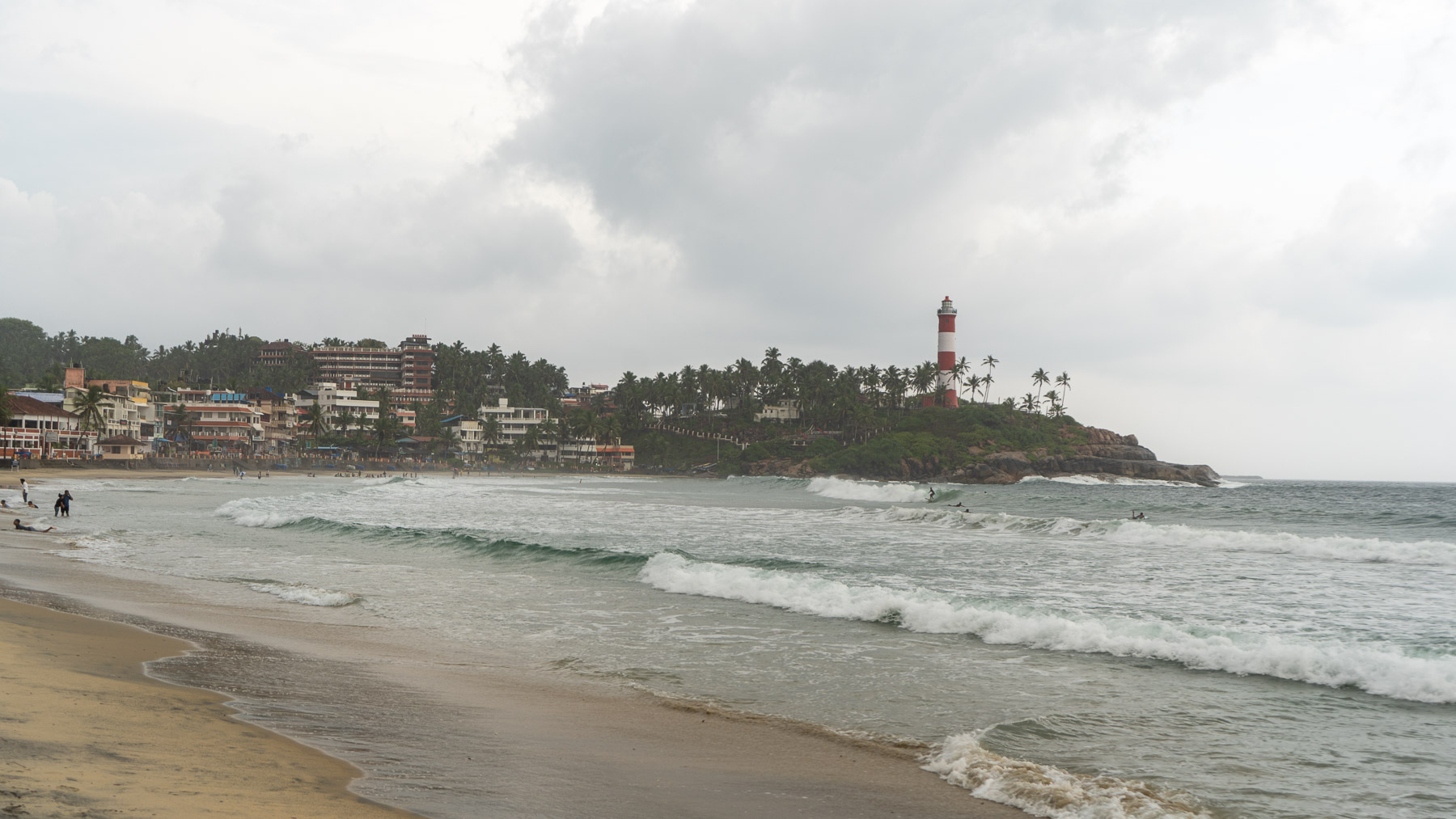 Boys surfing in kovalm beach - trivandrum, kerala