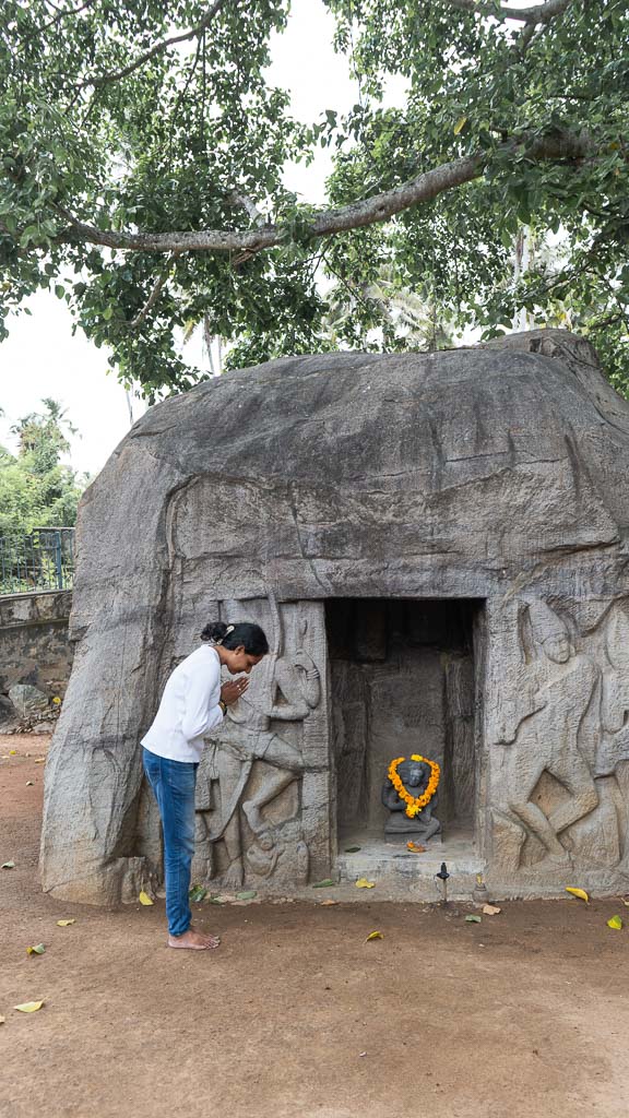 Lady standing infront of rock cut temple Vizhinjam - trivandrum,kerala