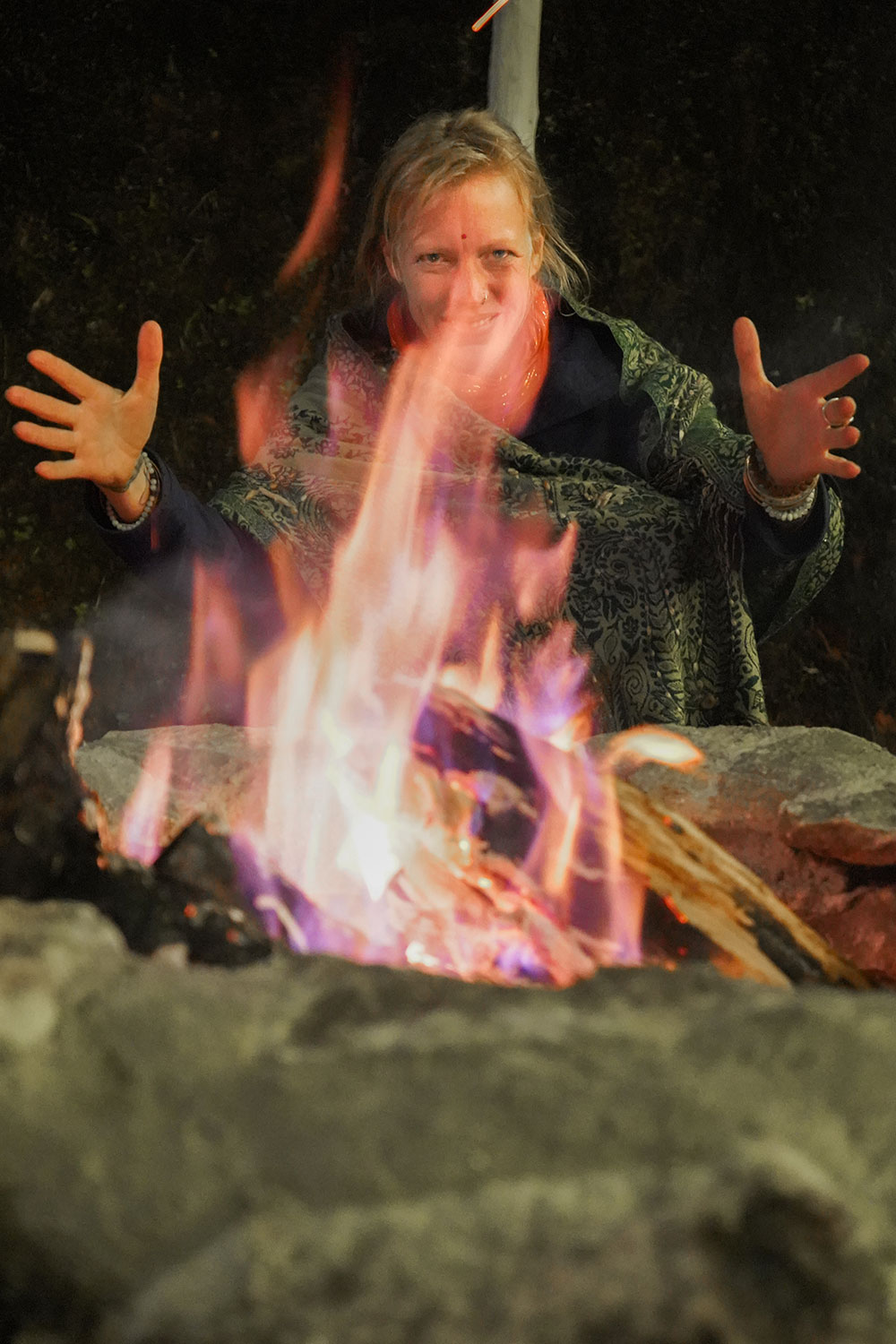 Camping-in-Munnar -lady-infront-of-fire-munnar-kerala-india-firstman.earth
