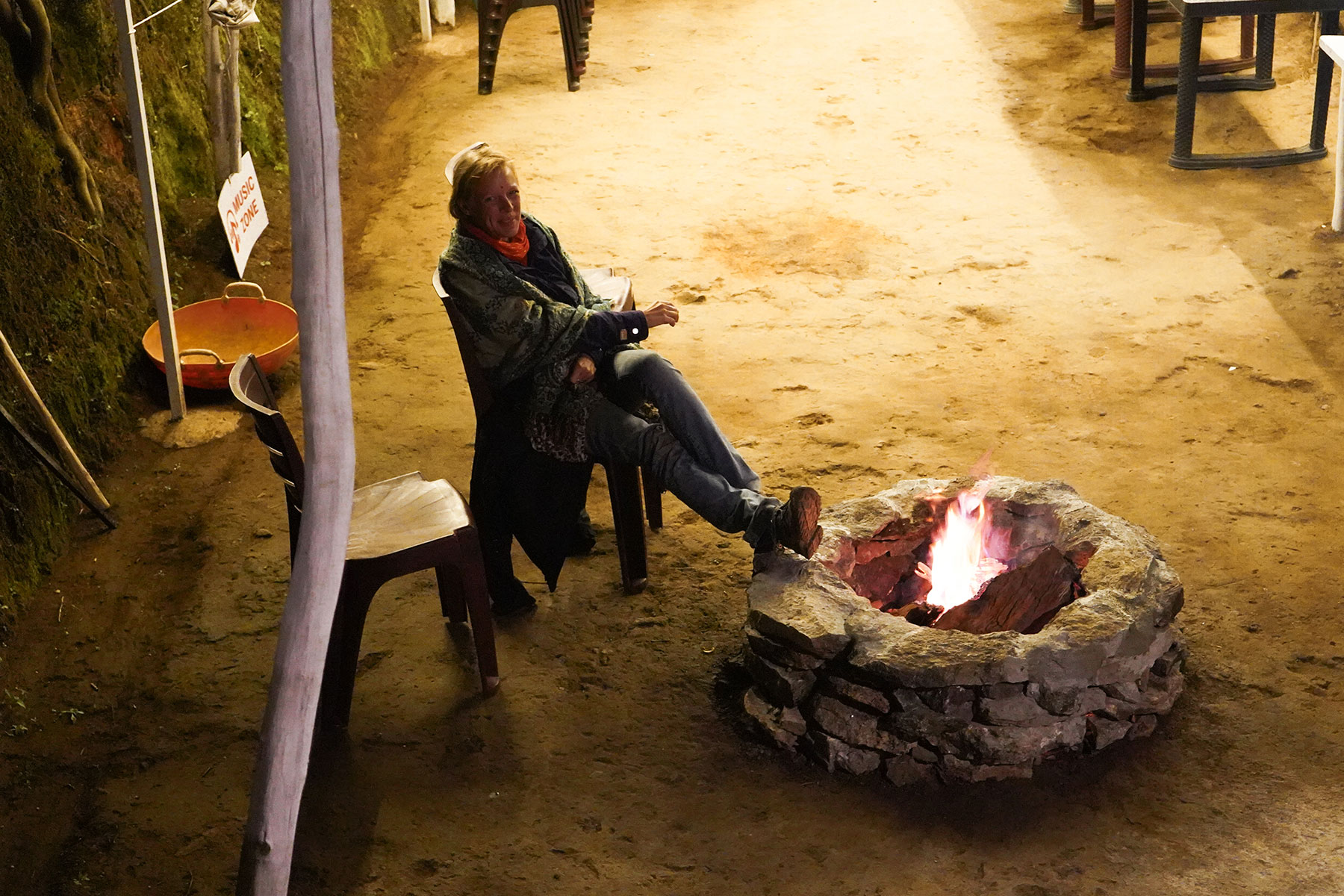 Camping-in-Munnar -women-enjoying-camp-fire-munnar-kerala-india-firstman.earth