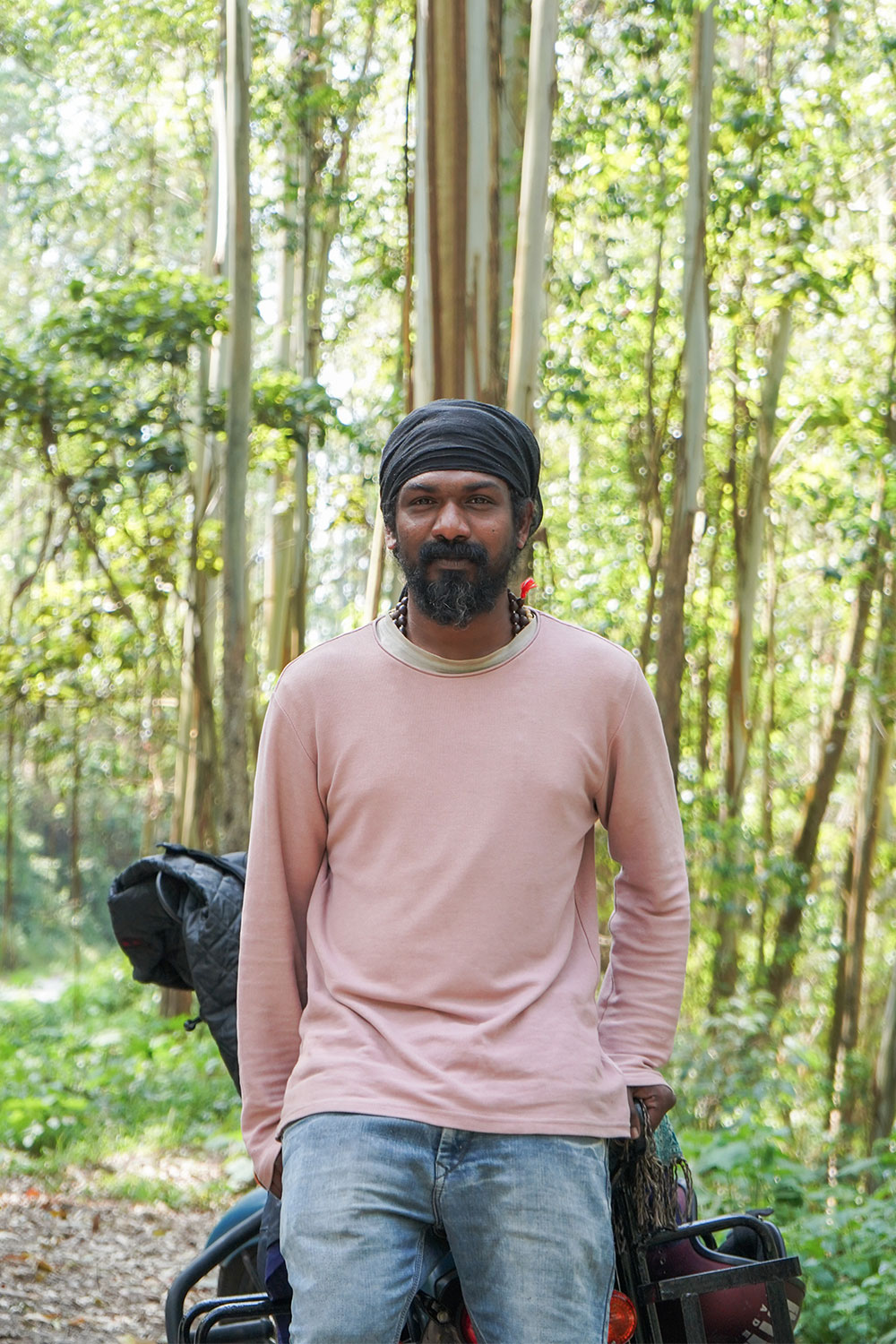 Eco-point-man-standing-with-bike-munnar-kerala-india-firstman.earth