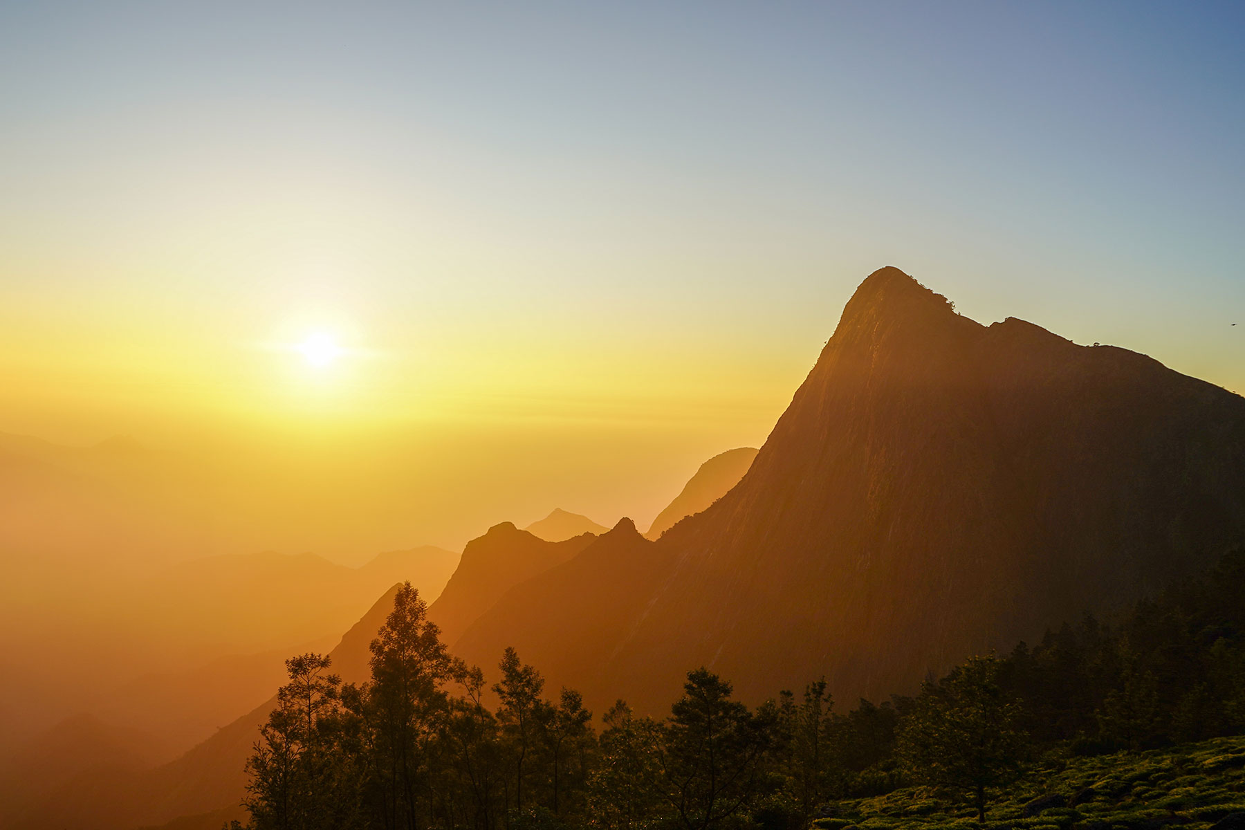 Kolukkumali-sun-rise-point-with-hills-munnar-kerala-india-firstman.earth